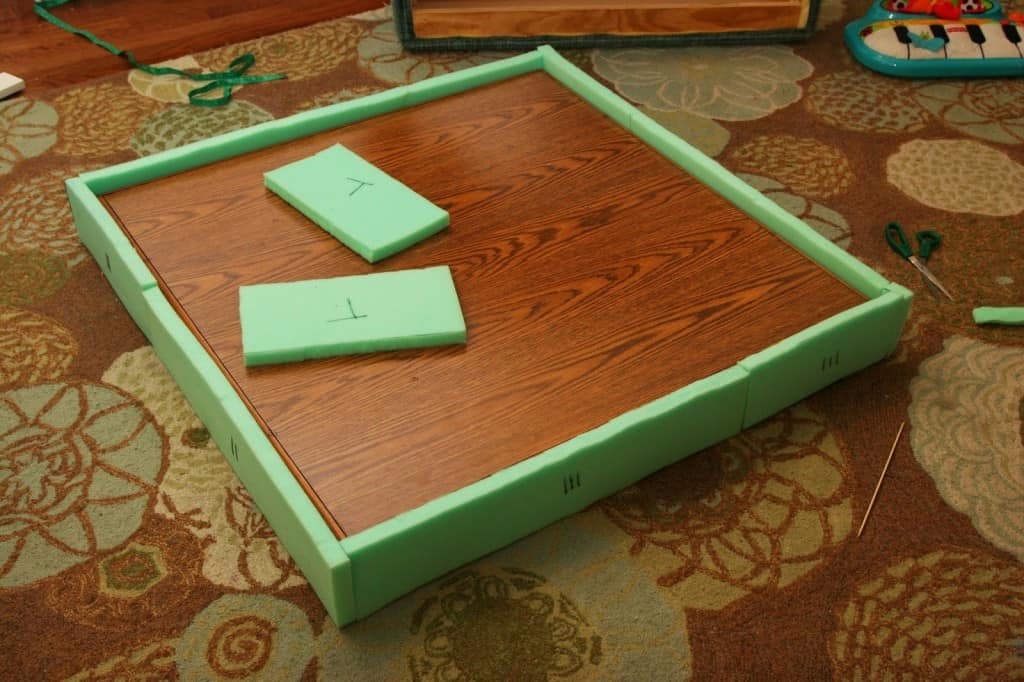 Take an ugly coffee table and transform it into a DIY ottoman! Save SO much on making a custom piece of furniture!!