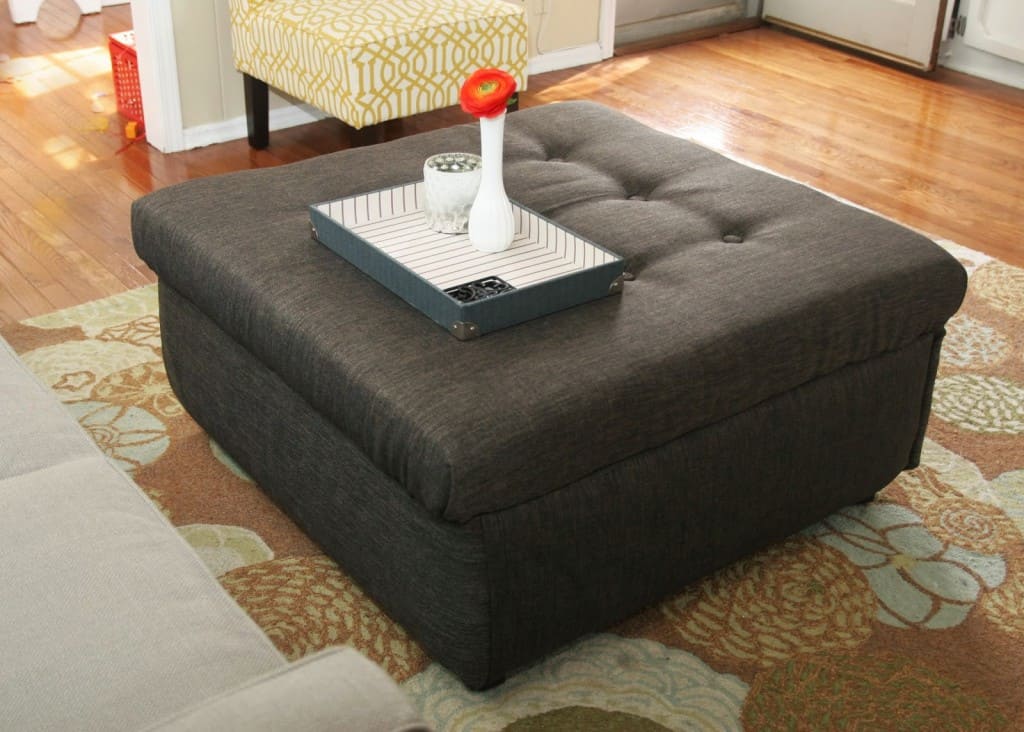 Take an ugly coffee table and transform it into a DIY ottoman! Save SO much on making a custom piece of furniture!!