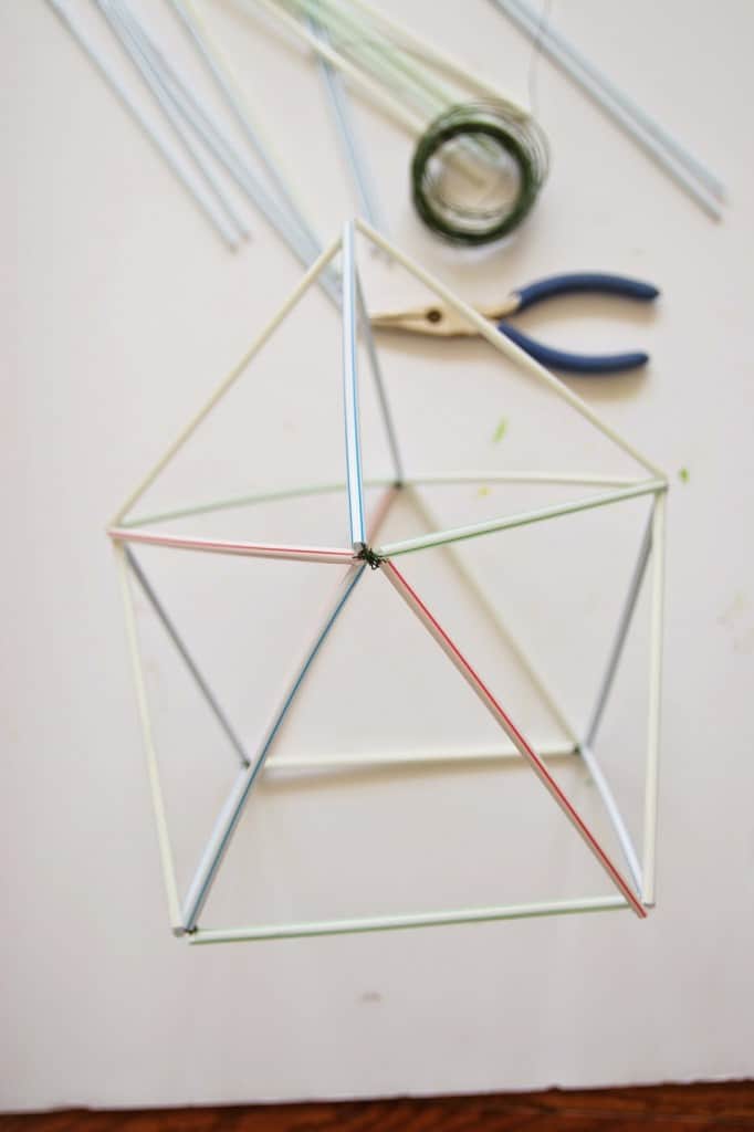 Learn how to make DIY geometric planters out of straws and wire! This little geometric craft is so easy and cheap to whip up!