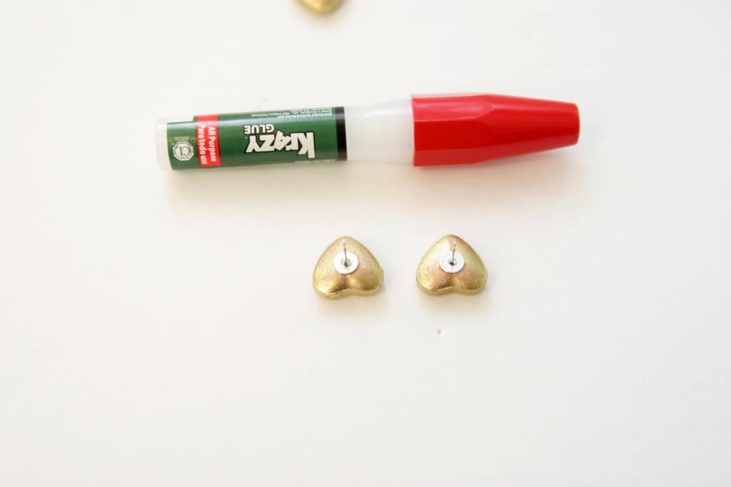 Spray paint some conversation hearts gold and turn them into earrings! Such a fun and easy Valentines day craft!