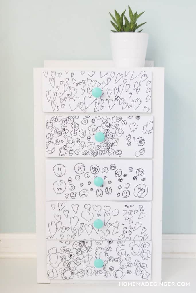 Learn how to do a DIY playroom furniture update for free. It's easy to update a furniture piece with kids artwork and just a few supplies!