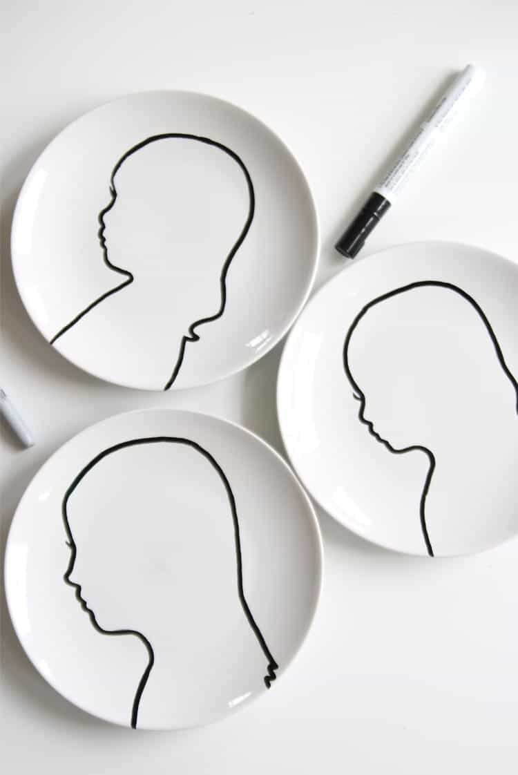 Create some modern silhouette art using white plates and a paint pen! It couldn't be easier.