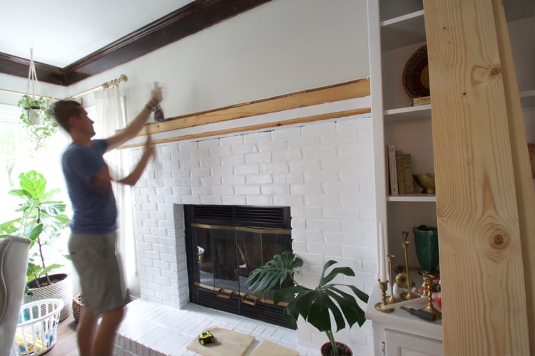 Learn how to update a brick fireplace with just a little work! This fireplace makeover is clean and modern!