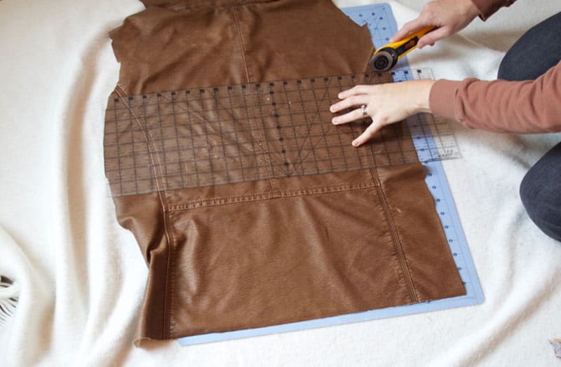 Turn a thrifted leather jacket into a DIY Leather Pillow. This DIY pillow tutorial is so simple for making some modern home decor pillows!