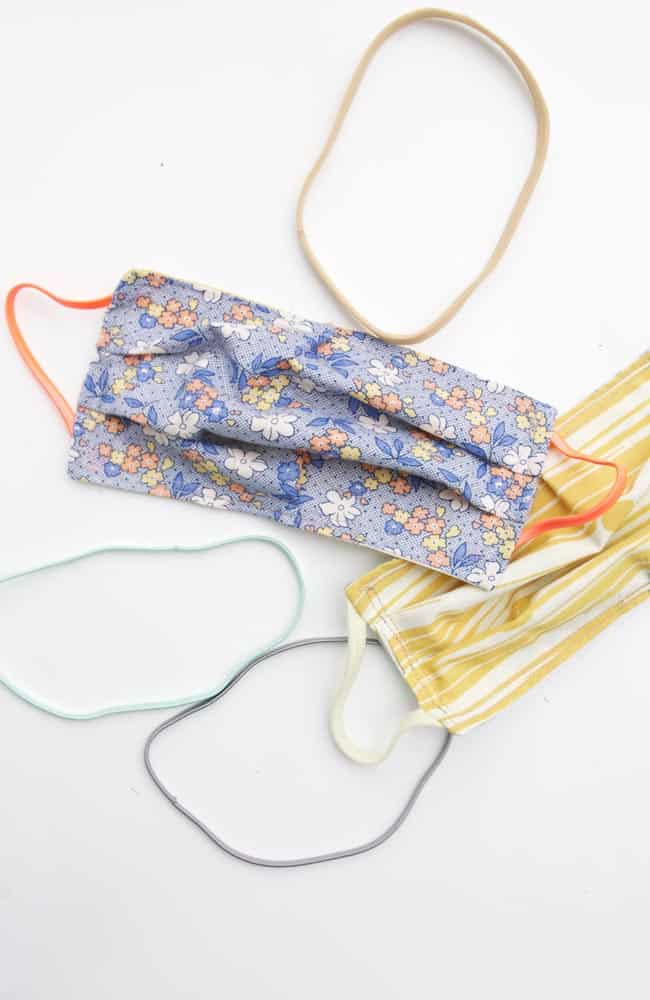 Learn how to sew a face mask using headbands. There is a shortage and elastic and masks with ties are difficult to wash, so use this tutorial to learn how to sew a face mask without elastic!